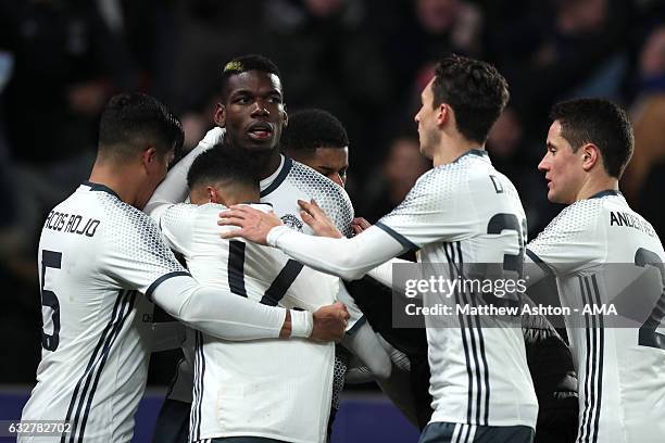 Paul Pogba of Manchester United celebrates with his team-mates after scoring a goal to make the score 1-1 during the EFL Cup Semi-Final second leg...