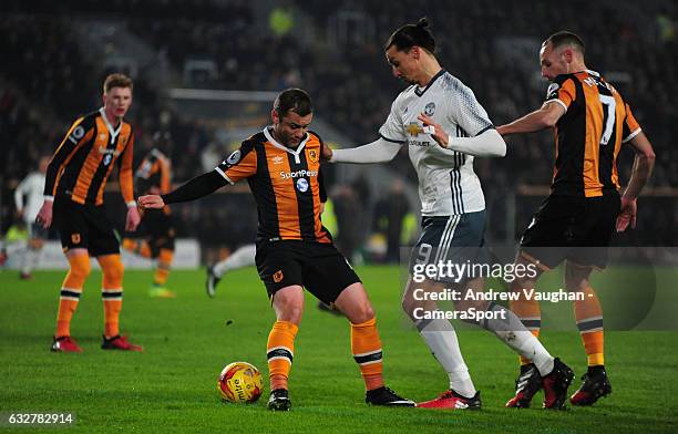 Manchester United's Zlatan Ibrahimovic looks to get between Hull City's Shaun Maloney and David Meyler during the EFL Cup Semi-Final Second Leg match...