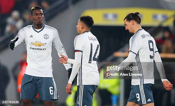 Paul Pogba of Manchester United celebrates with Jesse Lingard as he scores their first goal during the EFL Cup Semi-Final second leg match between...