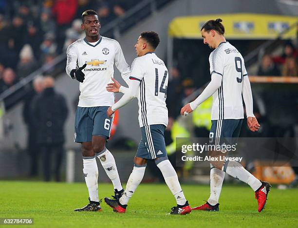 Paul Pogba of Manchester United celebrates with Jesse Lingard as he scores their first goal during the EFL Cup Semi-Final second leg match between...