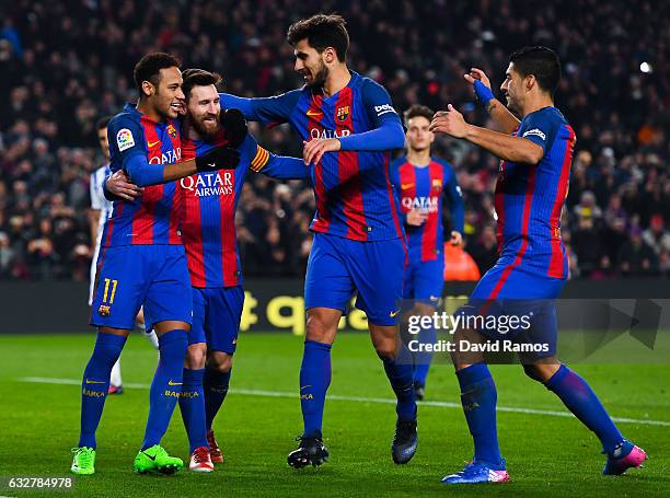 Lionel Messi of FC Barcelona celebrates with his team mates Neymar Jr. Andre Gomes and Luis Suarez after scoring from the penalty spot his team's...