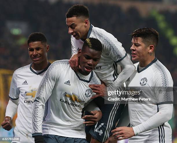 Paul Pogba of Manchester United celebrates scoring their first goal during the EFL Cup Semi-Final second leg match between Hull City and Manchester...