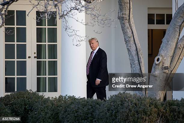 Upon returning from Philadelphia, U.S. President Donald Trump walks along the West Wing Colonnade on his way to the Oval Office at the White House,...