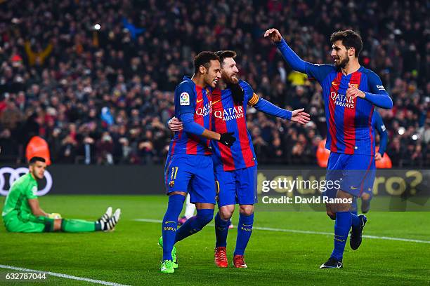 Lionel Messi of FC Barcelona celebrates with his team mates Neymar Jr. And Andre Gomes after scoring from the penalty spot his team's second goal...