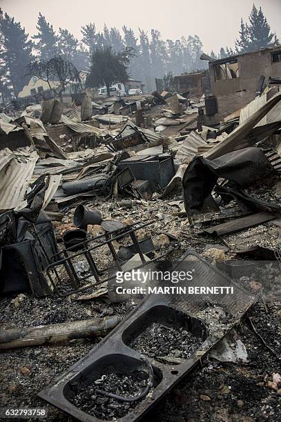 View of the town of Santa Olga, which was destroyed by a forest fire, 330 km south of Santiago, on January 26, 2017. Six people -- among them four...