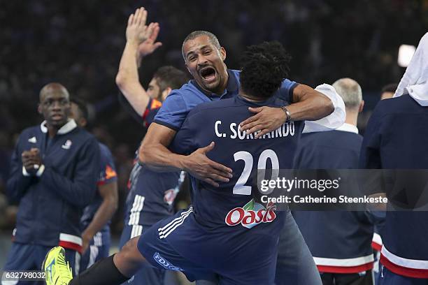 Didier Dinart Head Coach of France celebrates with Cedric Sorhaindo of France the victory of the 25th IHF Men's World Championship 2017 Semi Final...