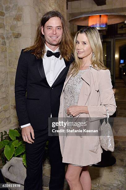 Christopher Backus and Mira Sorvino attend PSLA partners with Carolina Herrera for Winter Gala on January 26, 2017 in Beverly Hills, California.