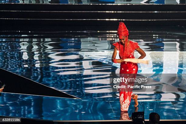 Miss Nigeria shows off her national costume at the Arena in Pasay City. Candidates from different countries showed off their national costumes during...