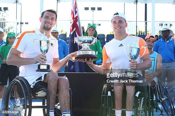Joachim Gerard of Belgium and Gordon Reid of Great Britain pose with their trophies after winning their Men's Wheelchair Doubles Final against...