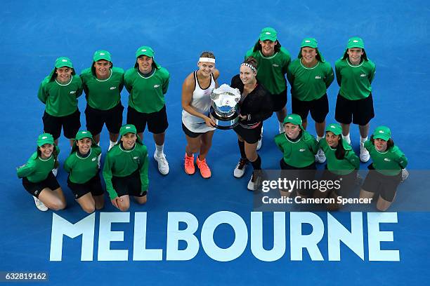 Bethanie Mattek-Sands of the United States and Lucie Safarova of the Czech Republic pose with the championship trophy after winning their Women's...