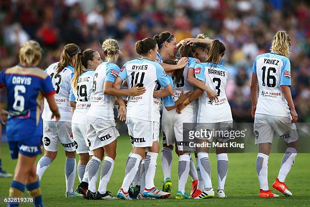 Amy Jackson of Melbourne City celebrates with team mates after scoring a goal during the round 14 W-League match between the Newcastle Jets and...