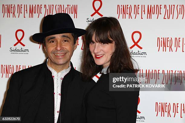 French journalist Ariel Wizman and his partner Osnath Assayag pose during a photocall upon arriving to attend the Diner de la Mode fundraiser dinner...