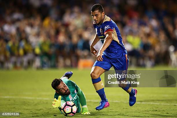 Andrew Nabbout of the Jets beats Melbourne City goalkeeper Dean Bouzanis to score the first goal during the round 17 A-League match between the...