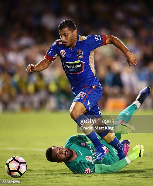 Andrew Nabbout of the Jets beats Melbourne City goalkeeper Dean Bouzanis to score the first goal during the round 17 A-League match between the...