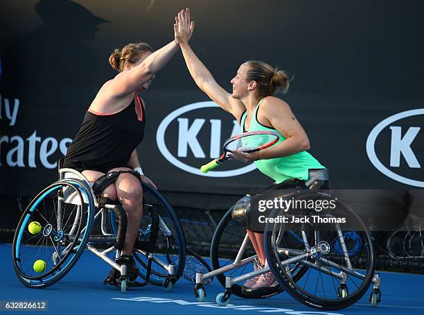 Jiske Griffioen and Aniek Van Koot of the Netherlands celebrate winning match point in their doubles final match against Diede De Groot of the...