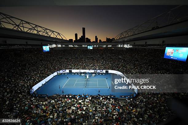 Fans watch the men's singles semi-final match between Spain's Rafael Nadal and Bulgaria's Grigor Dimitrov on day 12 of the Australian Open tennis...