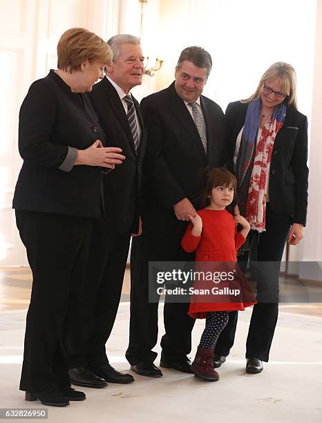 German Chancellor Angela Merkel, President Joachim Gauck, new Foreign Minister Sigmar Gabriel, Gabriel's wife Anke and daughter Marie pose for a...