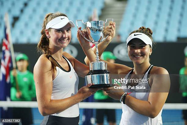 Bianca Vanessa Andreescu of Canada and Carson Branstine of the United States pose with the trophy after winning their Junior Girls' Doubles Final...