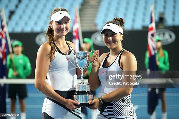 Bianca Vanessa Andreescu of Canada and Carson Branstine of the United States pose with the trophy after winning their Junior Girls' Doubles Final...