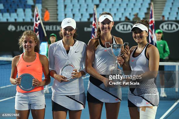 Maja Chwalinska and Iga Swiatek of Poland and Bianca Vanessa Andreescu of Canada and Carson Branstine of the United States pose with their trophies...