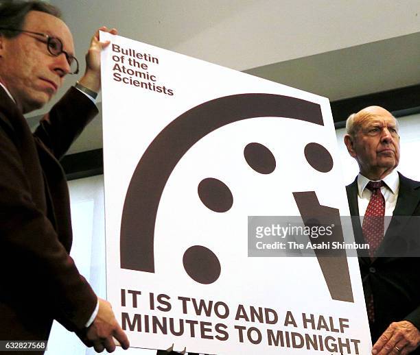 Members of the Bulletin of Atomic Scientists unveil the 2017 time for the "Doomsday Clock" January 26, 2017 in Washington, DC. For the first time in...