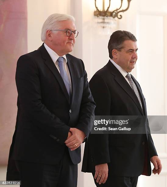 New German Foreign Minister Sigmar Gabriel and outgoing Foreign Minister Frank-Walter Steinmeier arrive for a ceremony at Schloss Bellevue palace in...