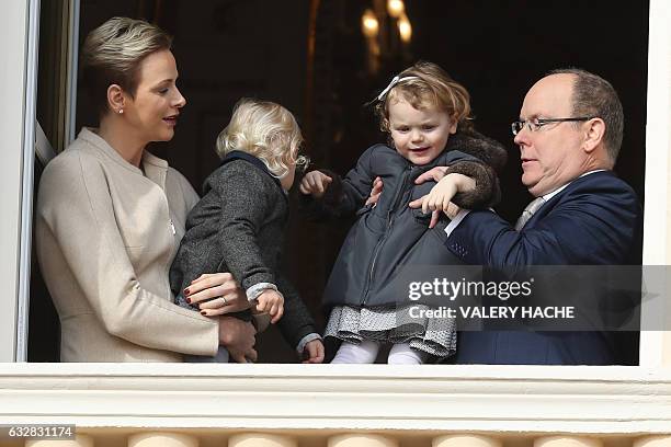 Prince's Albert II of Monaco and Princess Charlene of Monaco pose with their children, Prince's Jacques and Princess Gabriella , at the balcony...