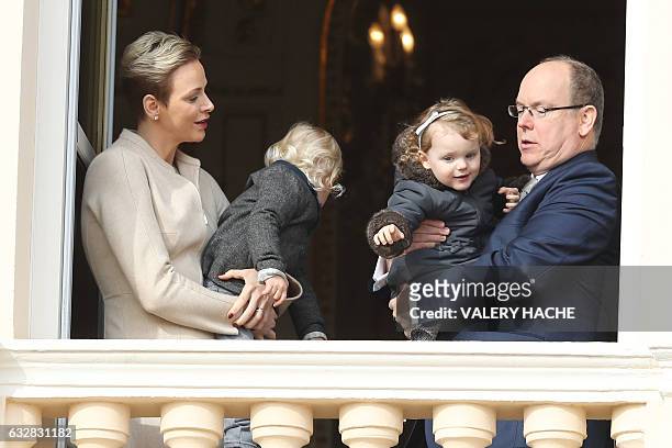 Prince's Albert II of Monaco and Princess Charlene of Monaco pose with their children, Prince's Jacques and Princess Gabriella , at the balcony...
