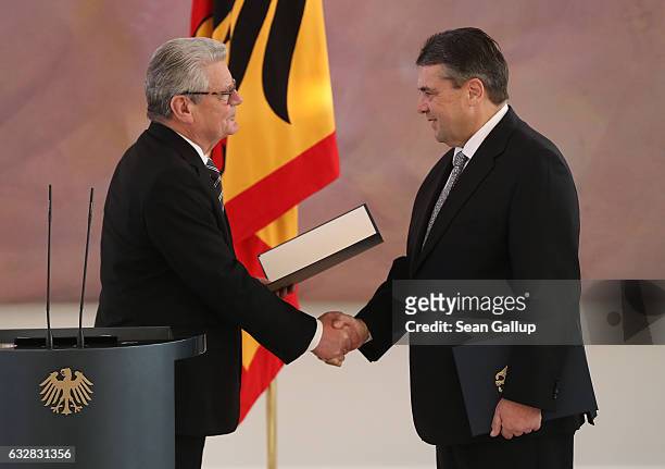 German President Joachim Gauck shakes hands with Sigmar Gabriel as he appointed him as Germany's new foreign minister during a ceremony at Schloss...