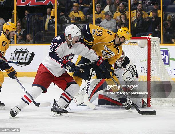 Columbus Blue Jackets goalie Sergei Bobrovsky makes a save on Nashville Predators left wing Colin Wilson as Columbus Blue Jackets defenseman Ryan...