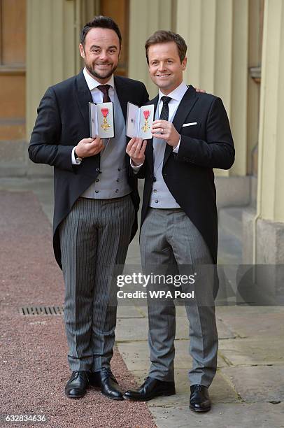 Presenters Ant and Dec pose with theirs OBEs received by the Prince of Wales during an Investiture ceremony at Buckingham Palace on January 27,...