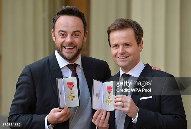 Presenters Ant and Dec pose with theirs OBEs received by the Prince of Wales during an Investiture ceremony at Buckingham Palace on January 27,...