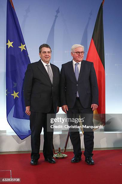 German Foreign Minister Frank-Walter Steinmeier hands over his office to his successor Sigmar Gabriel at the Ministry of Foreign Affairs on January...