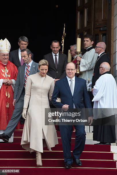 Prince Albert II of Monaco and Princess Charlene Of Monaco leave the Cathedral of Monaco after a mass during the ceremonies of the Sainte-Devote on...