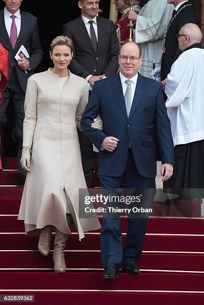 Prince Albert II of Monaco and Princess Charlene Of Monaco leave the Cathedral of Monaco after a mass during the ceremonies of the Sainte-Devote on...