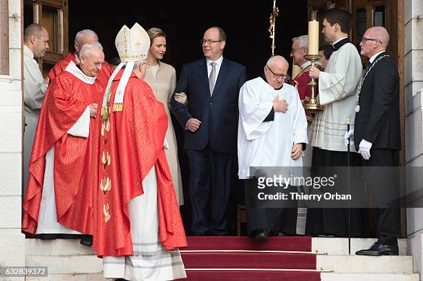 Prince Albert II of Monaco and Princess Charlene Of Monaco leave the Cathedral of Monaco after a mass during the ceremonies of the Sainte-Devote on...