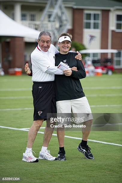Atlanta Falcons owner and CEO Arthur Blank with general manager Thomas Dimitroff on field during training camp workout at Falcons Headquarters...