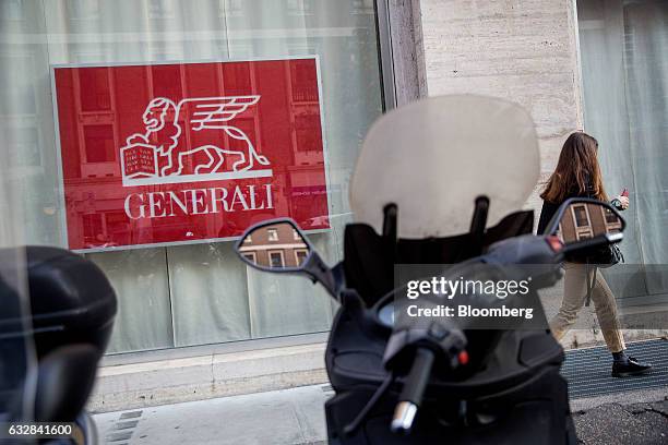 An Assicurazioni Generali SpA's logo sits in a window of their offices in Rome, Italy, on Friday, Jan. 27, 2017. Intesa Sanpaolo SpA Chief Executive...