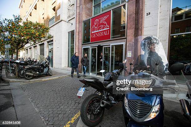 An Assicurazioni Generali SpA logo sits above an entrance to their offices in Rome, Italy, on Friday, Jan. 27, 2017. Intesa Sanpaolo SpA Chief...