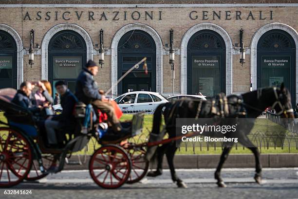 Horse-drawn carriage passes the headquarters of Assicurazioni Generali SpA in Rome, Italy, on Friday, Jan. 27, 2017. Intesa Sanpaolo SpA Chief...