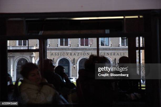 The Assicurazioni Generali SpA headquarters stand beyond a passenger bus in Rome, Italy, on Friday, Jan. 27, 2017. Photographer: Alessia...