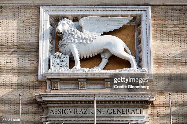 Sign sits below a Lion of St. Mark statue on a wall of the headquarters of Assicurazioni Generali SpA in Rome, Italy, on Friday, Jan. 27, 2017....