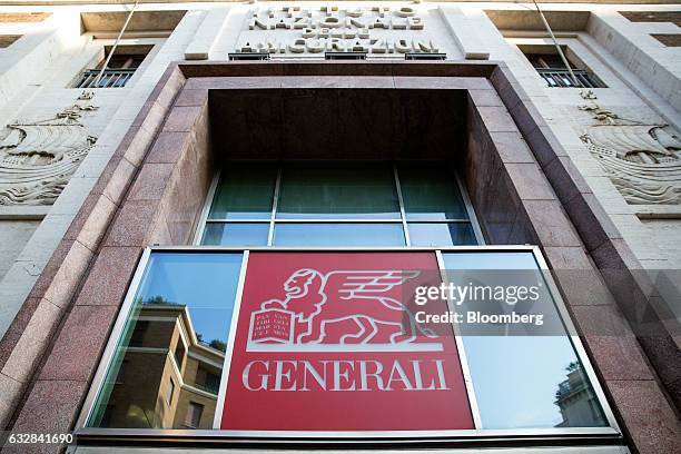 An Assicurazioni Generali SpA logo sits above an entrance to their offices in Rome, Italy, on Friday, Jan. 27, 2017. Intesa Sanpaolo SpA Chief...