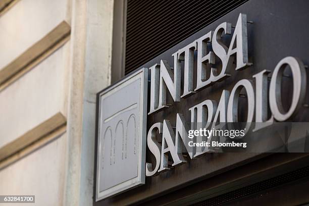 An Intesa Sanpaolo SpA logo sits on the side of one of their bank branches in Rome, Italy, on Friday, Jan. 27, 2017. Intesa Chief Executive Officer...