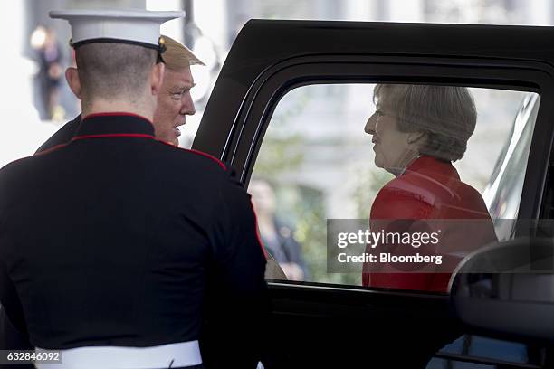President Donald Trump, left, welcomes Theresa May, U.K. Prime minister, while arriving to the West Wing of the White House in Washington, D.C.,...