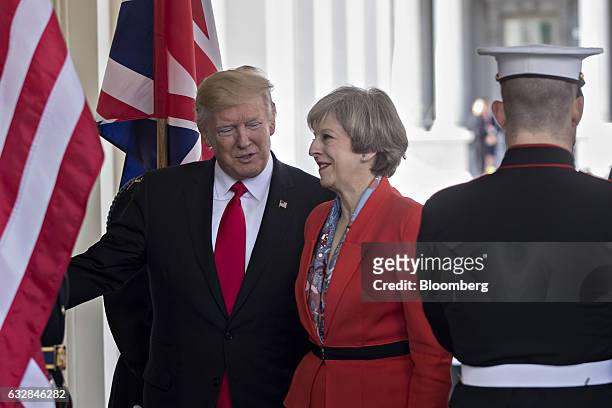 President Donald Trump, left, welcomes Theresa May, U.K. Prime minister, while arriving to the West Wing of the White House in Washington, D.C.,...