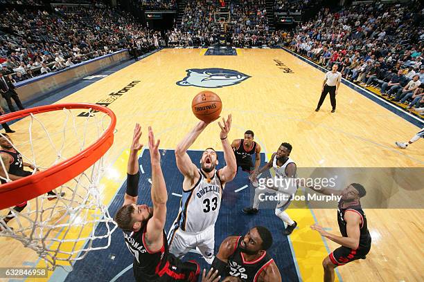 Marc Gasol of the Memphis Grizzlies drives to the basket and shoots the ball against the Toronto Raptors on January 25, 2017 at FedExForum in...
