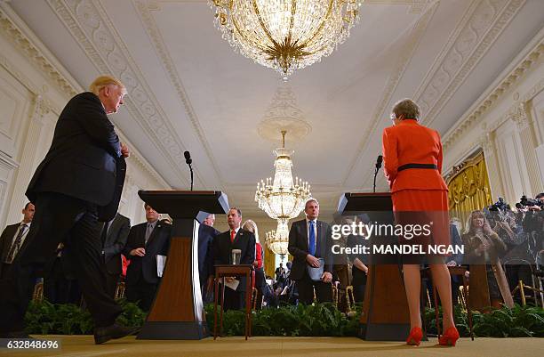 President Donald Trump and Britain's Prime Minister Theresa May arrive for a joint press conference in the East Room of the White House on January...