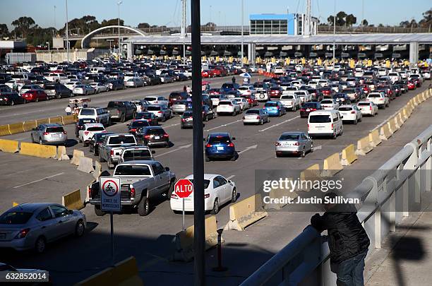 Cars wait in line to enter the United States at the San Ysidro Port of Entry on January 27, 2017 in Tijuana, Mexico. U.S. President Donald Trump...