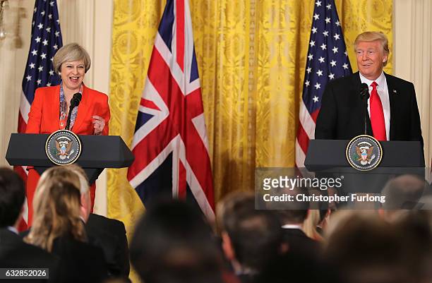 British Prime Minister Theresa May and U.S. President Donald Trump smile during a joint press conference in The East Room at The White House on...